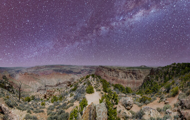 Panoramic aerial view of Grand Canyon South Rim on a starry night.