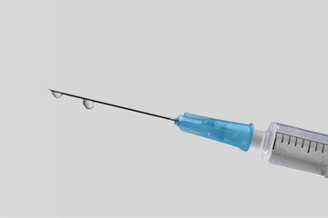 Fototapeta premium A syringe in front of the blurred background for mandatory vaccination,