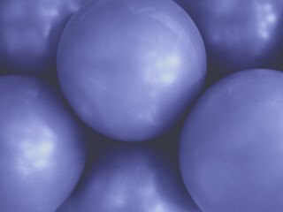 Abstract balls of stylish purple color. Beautiful background of trendy color. Rough abstract textures in the stylish color of the year 2022