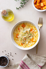 Risotto with pumpkin, cheese and thyme. Vegetarian food. Healthy eating.