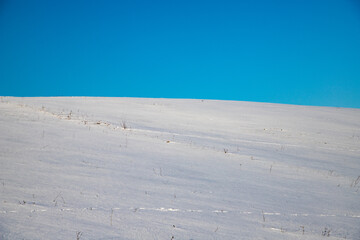Fototapeta na wymiar white snow and blue sky background