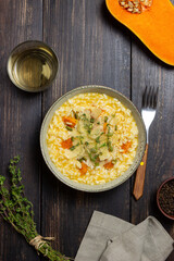 Risotto with pumpkin, cheese and thyme. Vegetarian food. Healthy eating.