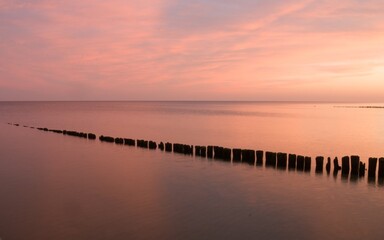 Fototapeta na wymiar Sunset over the Baltic Sea in Kołobrzeg.