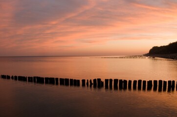 Sunset over the Baltic Sea in Kołobrzeg. - obrazy, fototapety, plakaty