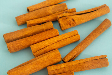 Cinnamon flavor closeup Aromatic Cuisine. On green background. Top view. With copy space