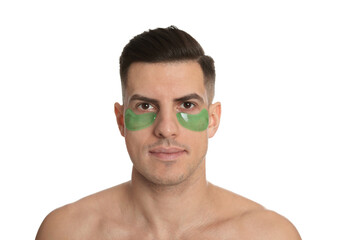 Man with green under eye patches on white background