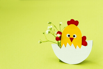 Easter. Easter decor. Decorative chicken on a light background. Easter decorations. Blank for a greeting card. Copy space. - 484200720