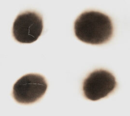 Collage paper burn black  stain isolated over the white background. set round paper burn mark close...