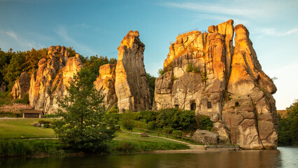 Rock formation at sunrise. With a lake in the foreground. externalstones