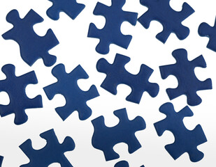 Blue jigsaw puzzle pieces isolated on white background.
