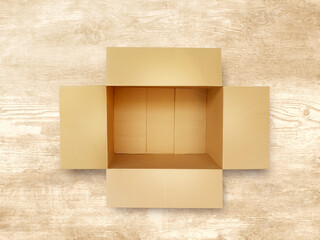 Brown blank paper box isolated on wooden background.