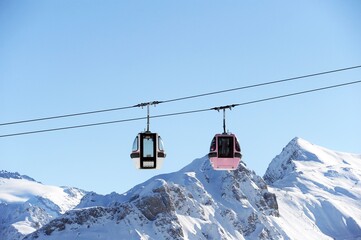 Vintage ski lifts in the mountains by winter 