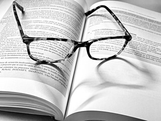 Reading a book with glasses