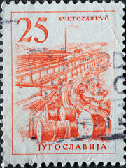 Yugoslavia - circa 1961 : a postage stamp from Yugoslavia, showing a Cable factory in Svetozarevo.