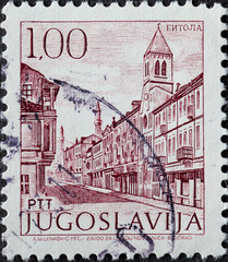 Yugoslavia - circa 1971 : a postage stamp from Yugoslavia, showing a townscape with Church in...