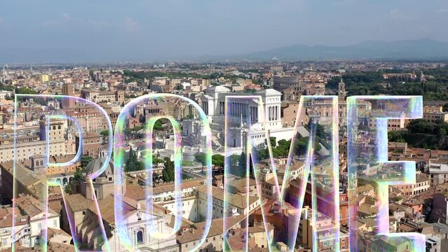 Roma scritto a caratteri cubitali sullo sfondo dell'Altare della Patria e del Colosseo.
Vista aerea della scriita "ROMA" in 3D sui fori Imperiali, sul Colosseo e sull'Altare della Patria.