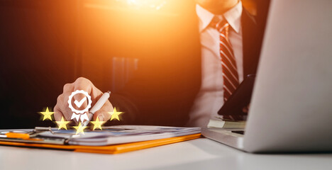 Customer service and Satisfaction concept, Business people touching the virtual screen on the happy Smiley face icon to give satisfaction in service. rating very impressed.