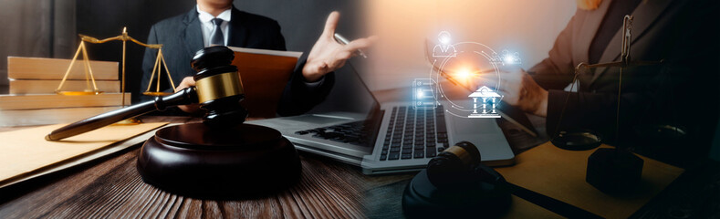 Judge gavel with Justice lawyers having team meeting at law firm in background. Concepts of law.