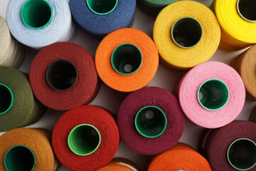 Colorful thread spool background, close-up