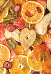 background from various multicolored dried fruits, top view