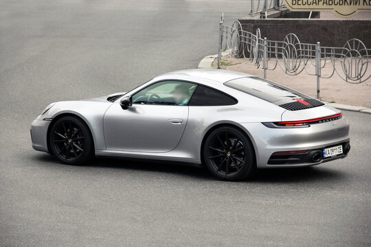 Kiev, Ukraine - June 19, 2021: Gray supercar Porsche 911 on the road. Porsche in the city