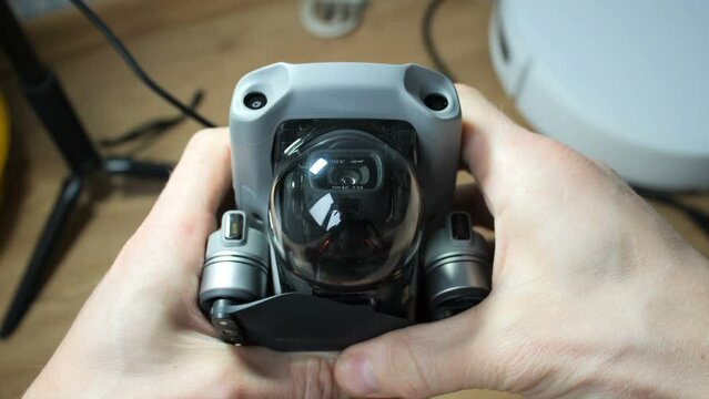 camera from a quadrocopter in protective glass in hands

