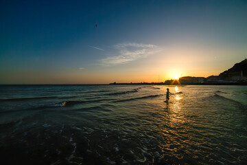 Fototapeta na wymiar Mysterious sunset or sunrise over the beach and sea.