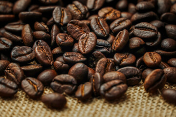 Roasted coffee beans placed on a sack	