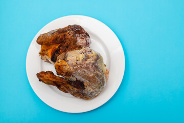 frozen grilled chicken with ice on white plate