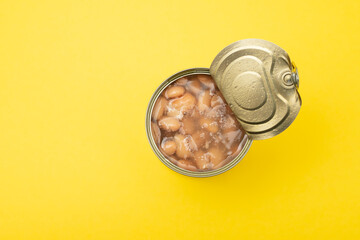 canned food boiled beans in iron on yellow paper