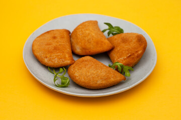 typical portuguese appetizer rissois de carne on plate