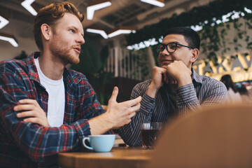 Multiracial business men working in office space