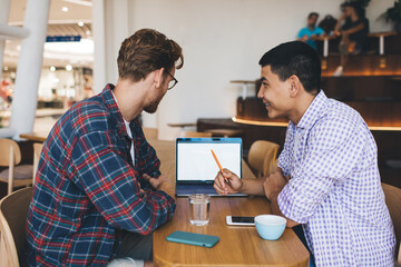 Multiracial business men working in office space