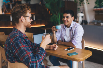 Multiracial business men working in office space