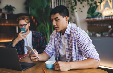 Multiracial business men working in office space