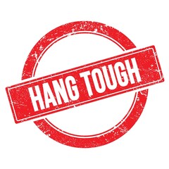 HANG TOUGH text on red grungy round stamp.