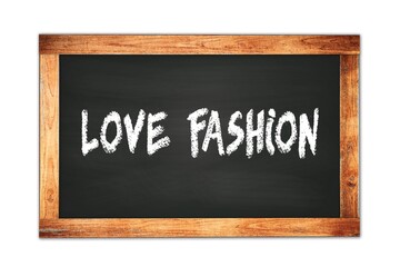 Fototapeta premium LOVE FASHION text written on wooden frame school blackboard.