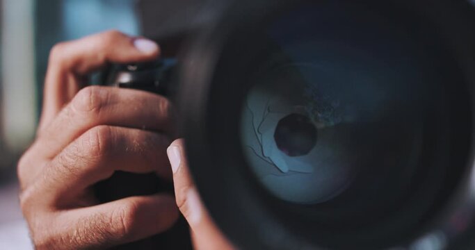 Man takes a photo close up of lens iris blades