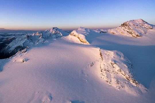Winter sunrise on snowcapped Monte Disgrazia, Sassa Entova, Pizzo Malenco and Scerscen glacier, Valmalenco, Lombardy, Italy