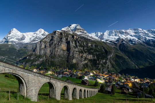 Alpine village of Murren and funicular railway lit by star trail, Lauterbrunnen, Jungfrau Region, Bern Canton, Swiss Alps, Switzerland