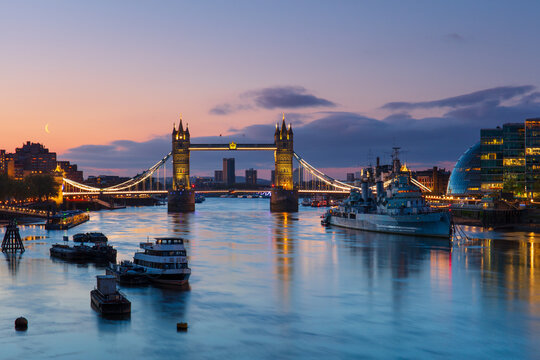 Tower Bridge and HMS Belfast at sunrise, London, England