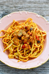 Traditional indonesian meal bami goreng with noodles, vegetables and chicken