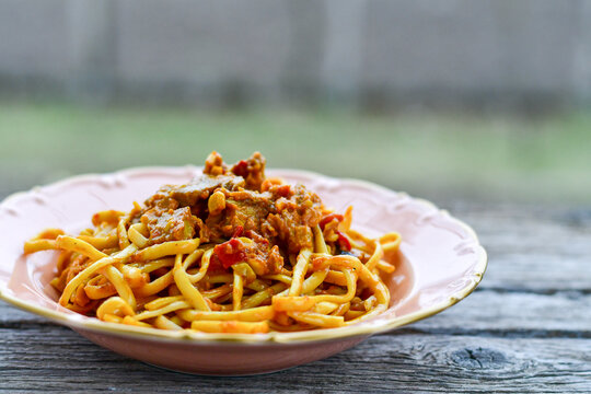 Traditional indonesian meal bami goreng with noodles, vegetables and chicken