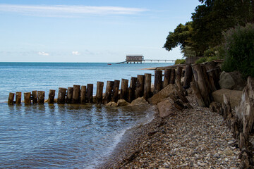 Fototapeta na wymiar Bembridge beach with the lifeboat station in the background.