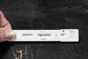 Positive diagnostic test result at SARS-CoV-2 (Covid-19) coronavirus pandemic.Concept for omicron variant, corona virus
