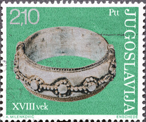 Yugoslavia - circa 1975 : a postage stamp from Yugoslavia, showing an antique Silver Bangle, Kosovo