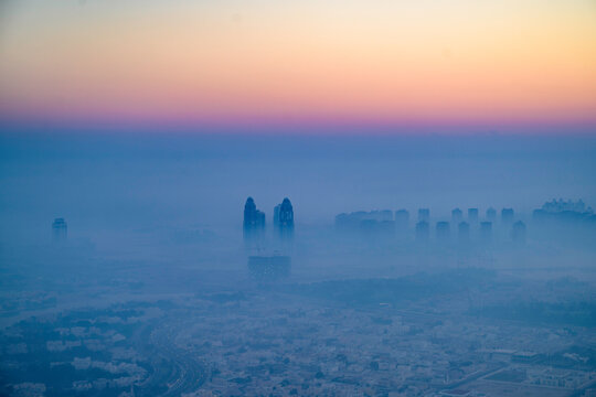 Doha The Pearl at sunrise with morning fog