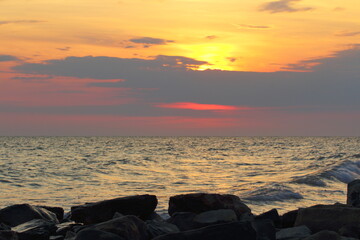 seascape bright sunset on a rocky shore