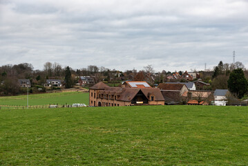Leuven, Flemish Brabant Region, Belgium - 01 29 2022: Country houses in the meadows at the suburbs