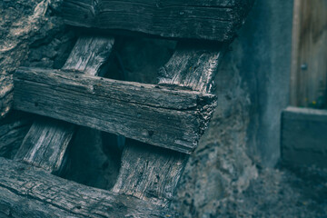Weathered old wood texture background. Facade wooden house in village in Swiss Alps. The barns, stores, stables and old houses. Timber wood wall texture background.
